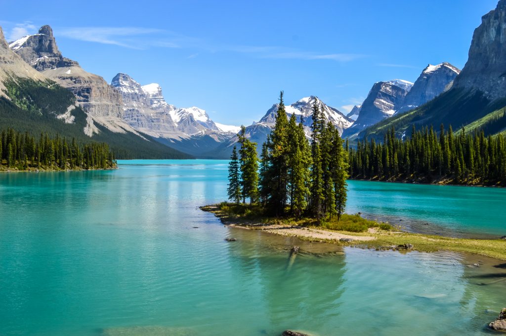 Spirit Island sits surrounded my turquoise waters. The backgound is framed out by the Canadian Rocky Mountains in Jasper Nation Park, Alberta, Canada