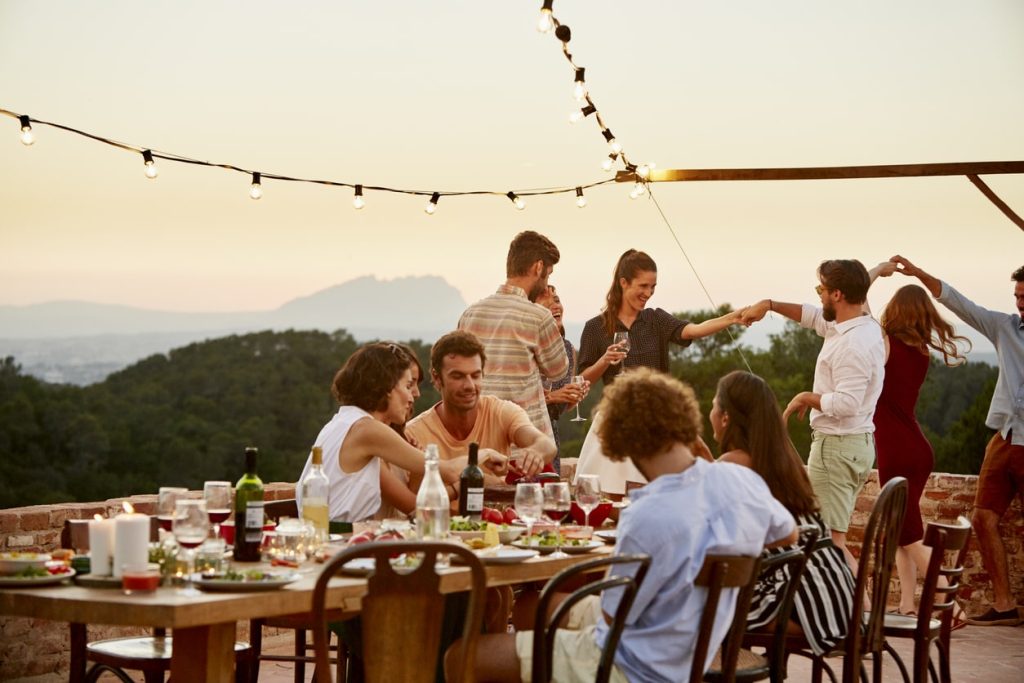 A group of foodies gather to eat and dance while travelling