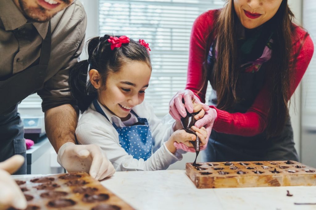 A young famoly tries making local cuisines at a chocolate