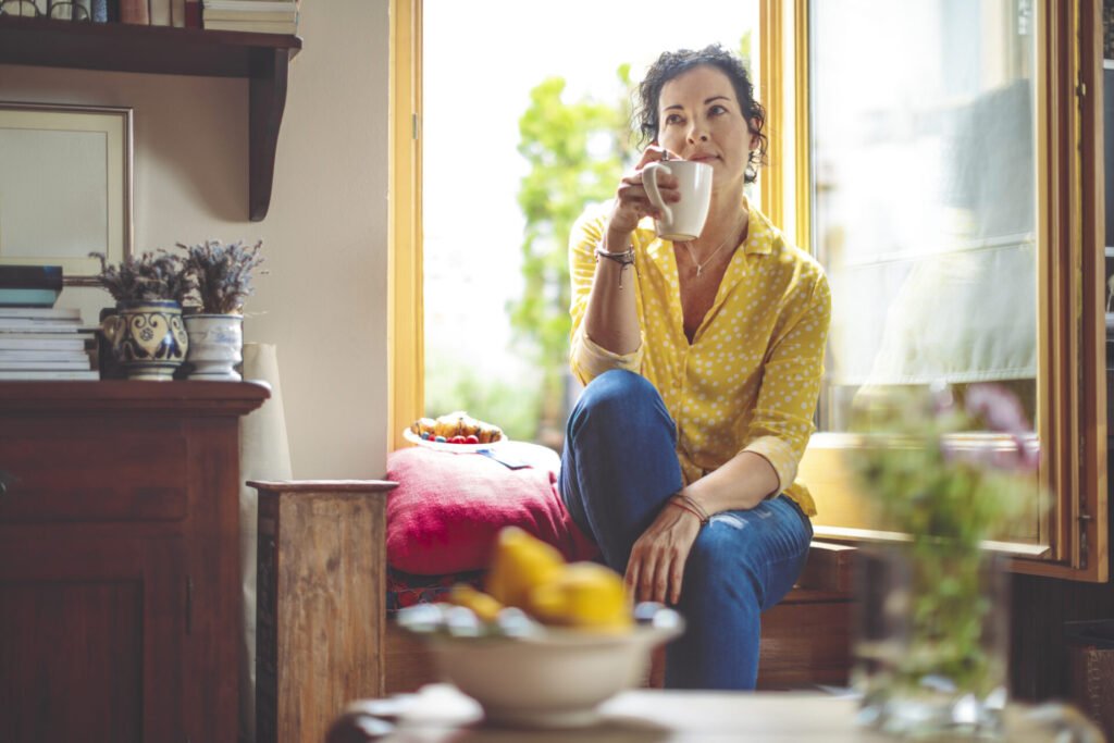 woman is having the morning coffee at home