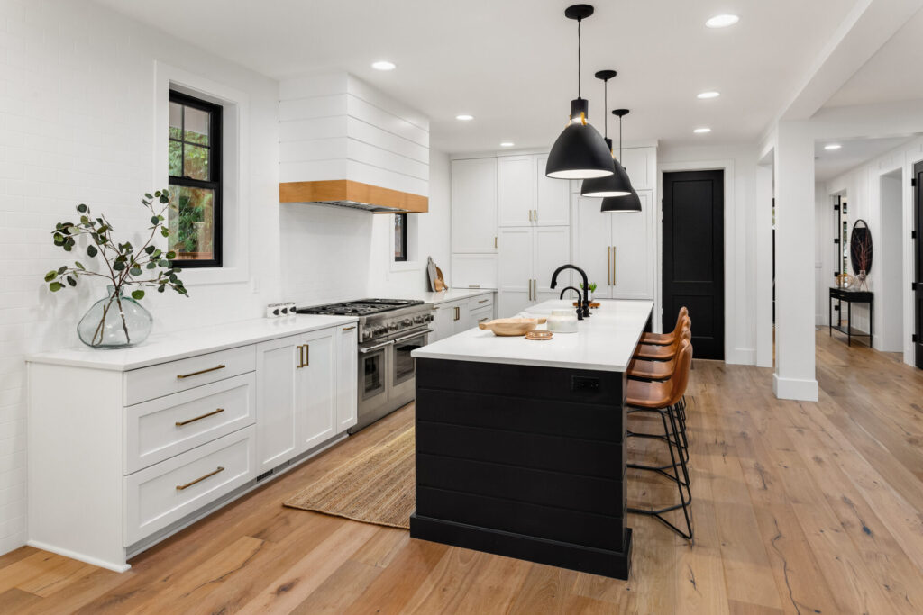 white kitchen with dark accents in new farmhouse style luxury home