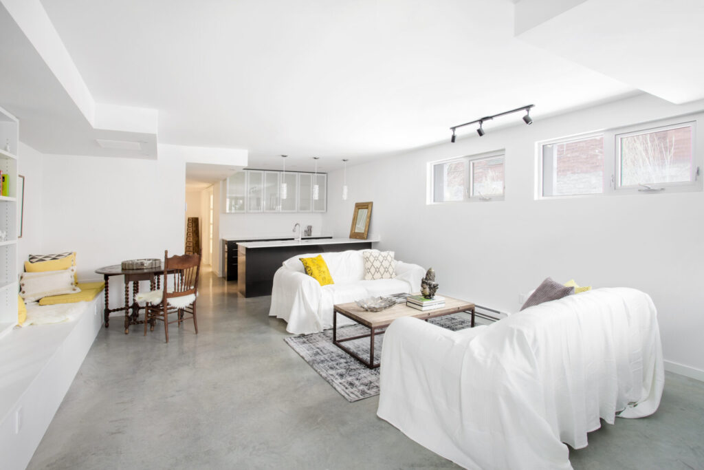 Bright white open plan living room and kitchen.