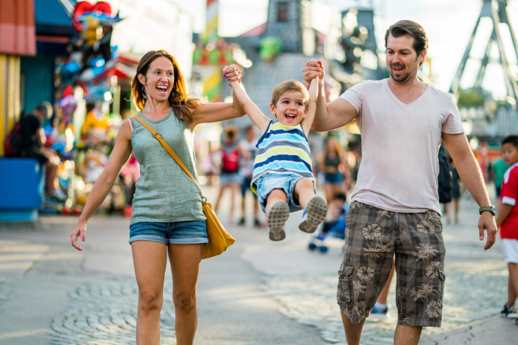 family enjoying day in amusement park