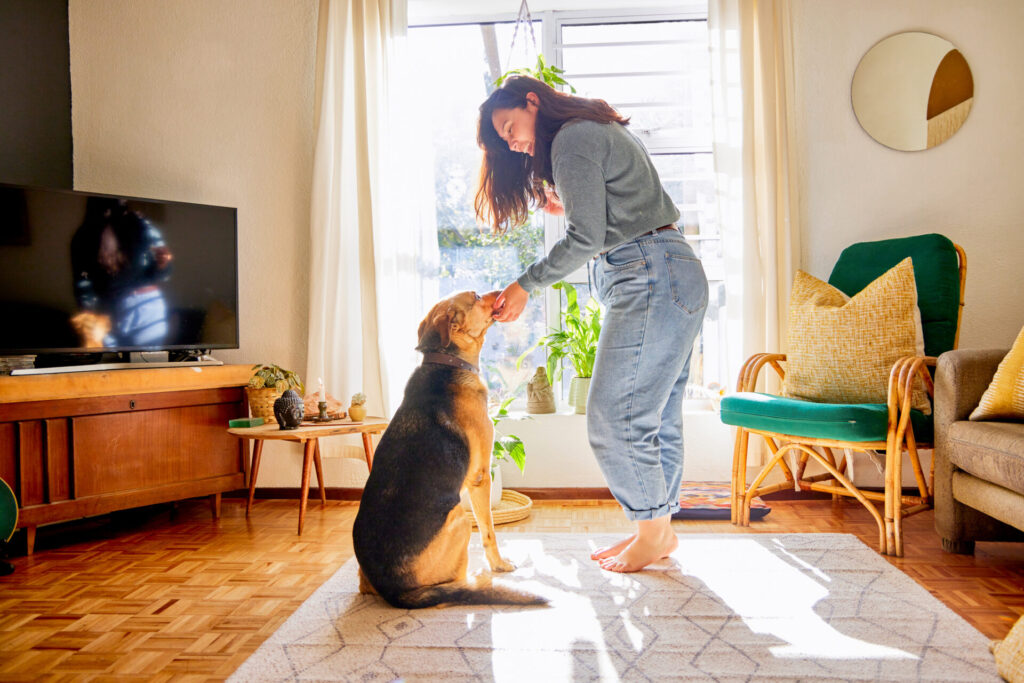 woman playing with her dog