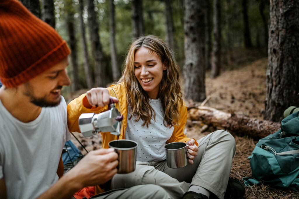 women serving coffee during hiking