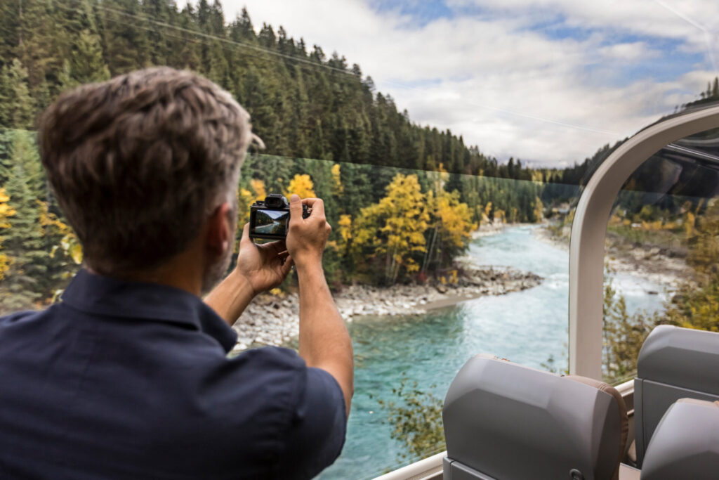 Rocky Mountaineer man taking a photo