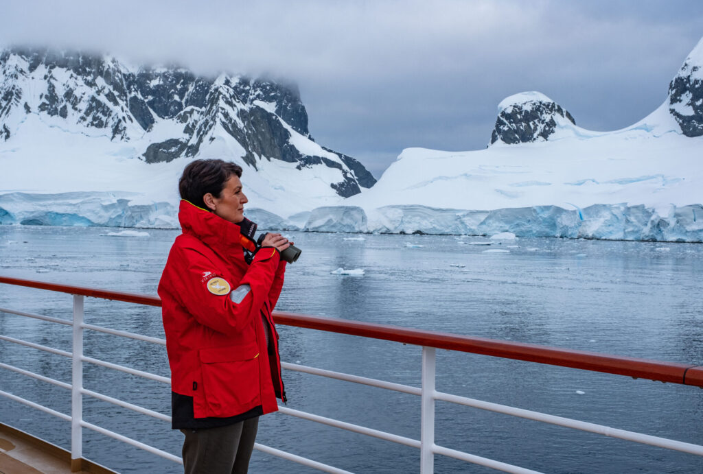 Viking guest on the sundeck of the Viking Octantis in Antarctica.