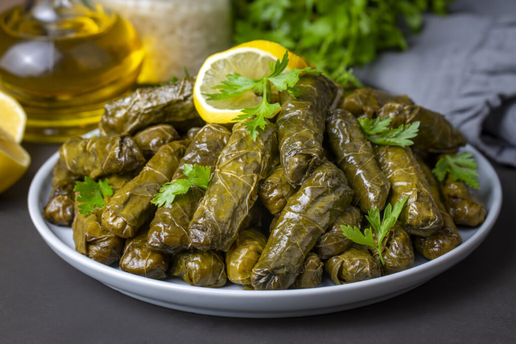 Delicious dolma (sarma) stuffed grape leaves rice. Lebanese dolma sarma on plate.