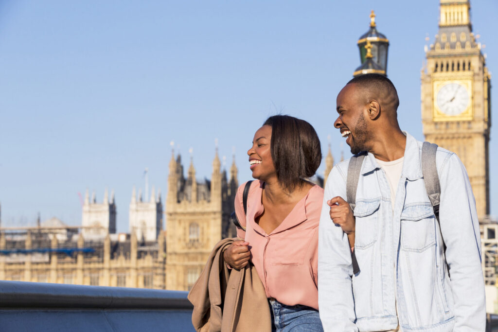 Happy couple walking jovially together in London