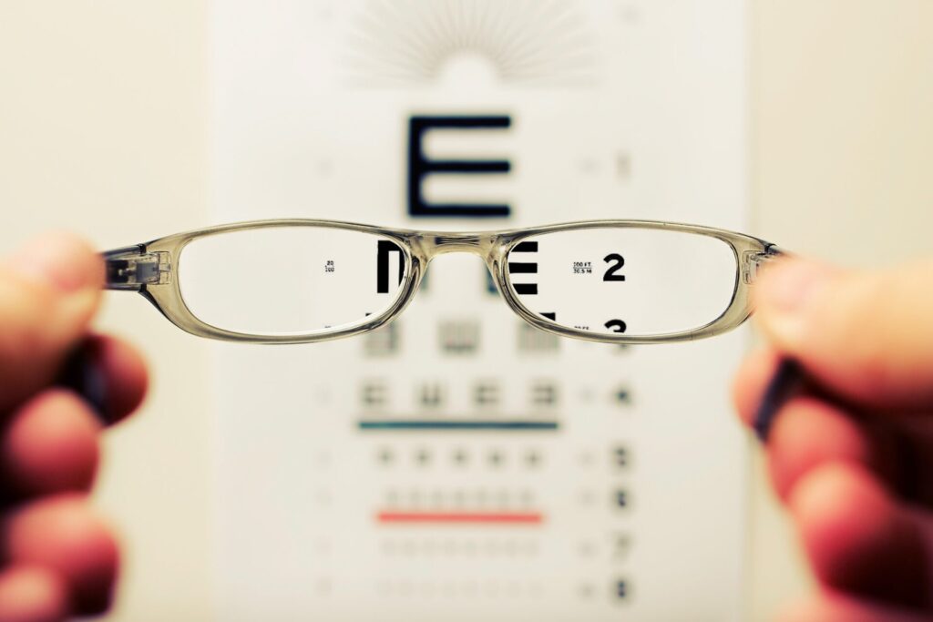 person holding eyeglasses