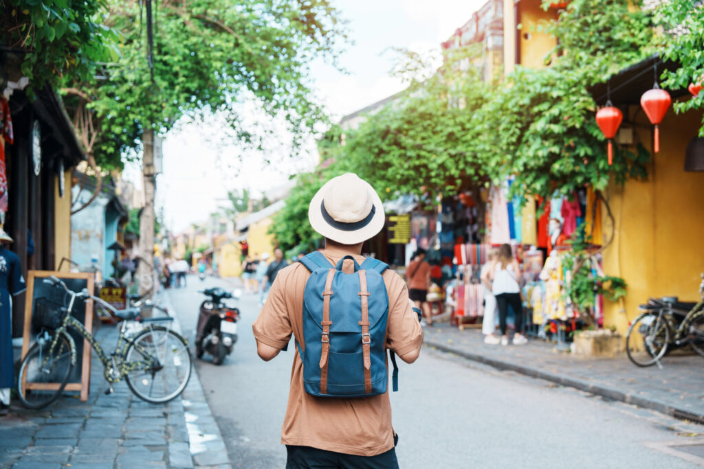 Solo traveler sightseeing at Hoi An ancient town in central Vietnam