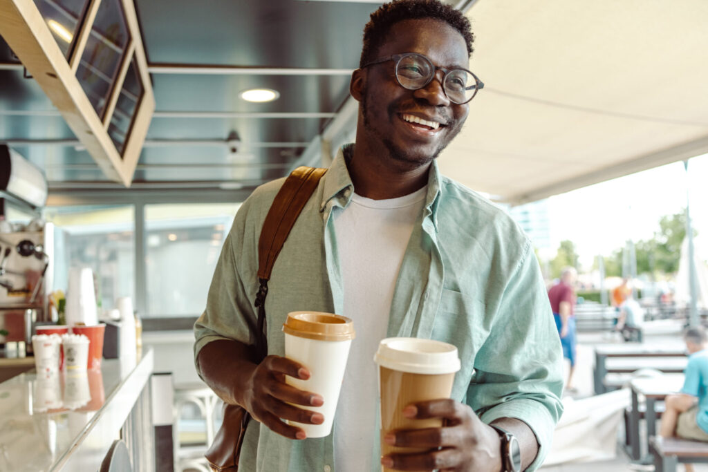 student picking up a coffee