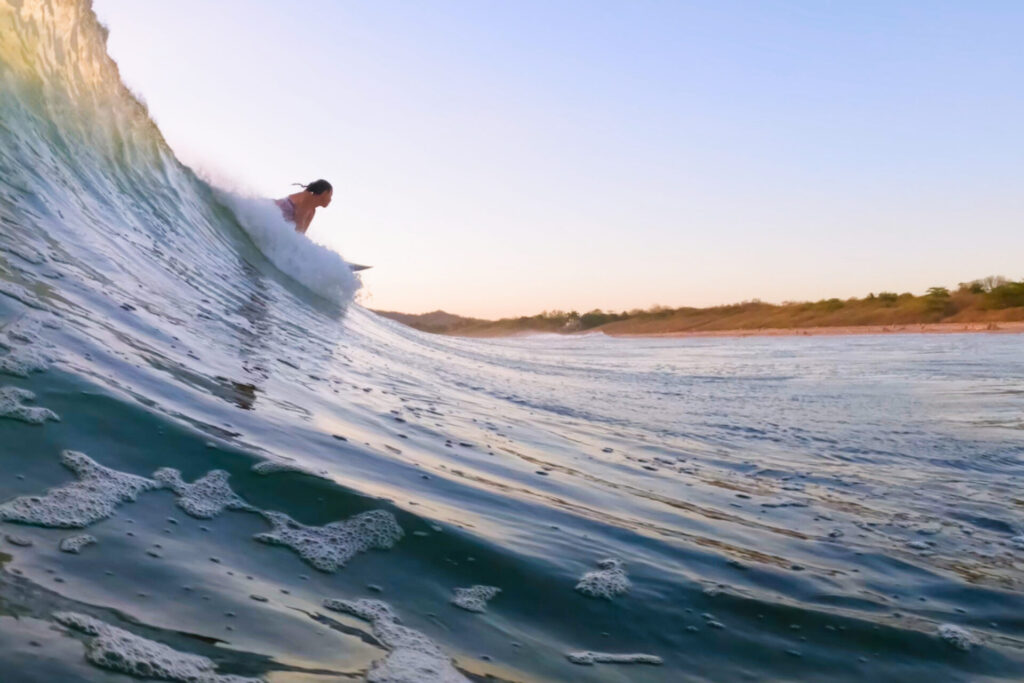 Woman Surfing Away from the Camera in Costa Rica