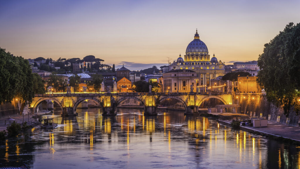 Rome sunset over Tiber and St Peters Basilica Vatican Italy