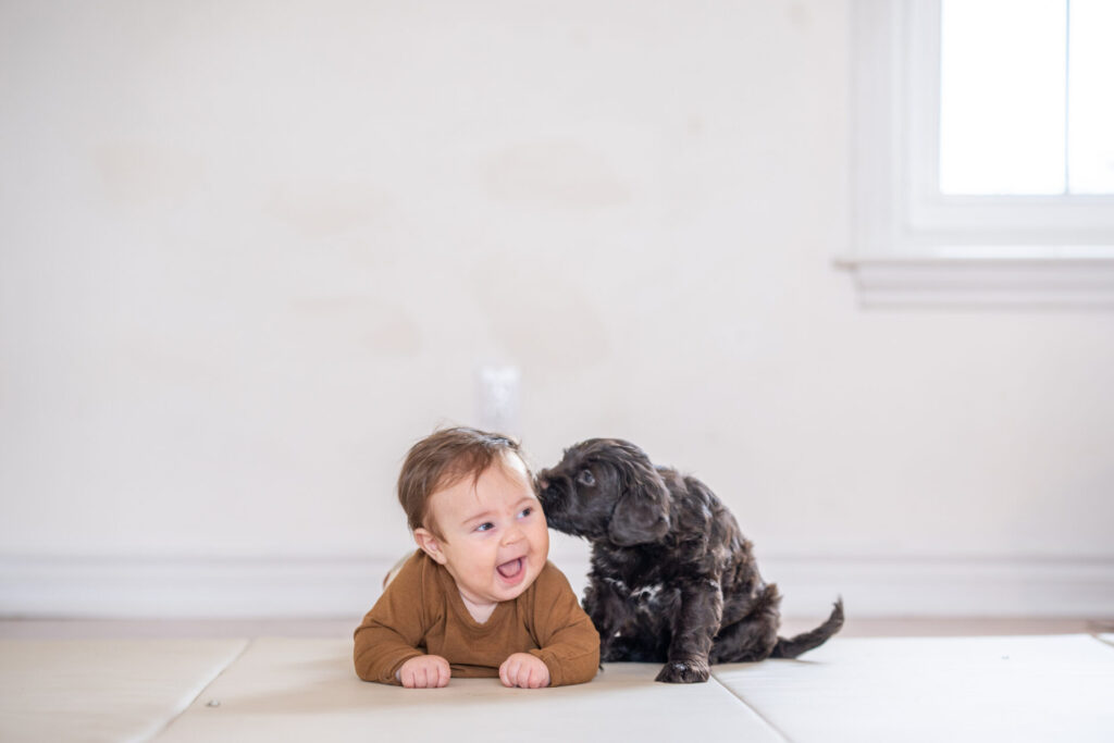 baby with a puppy